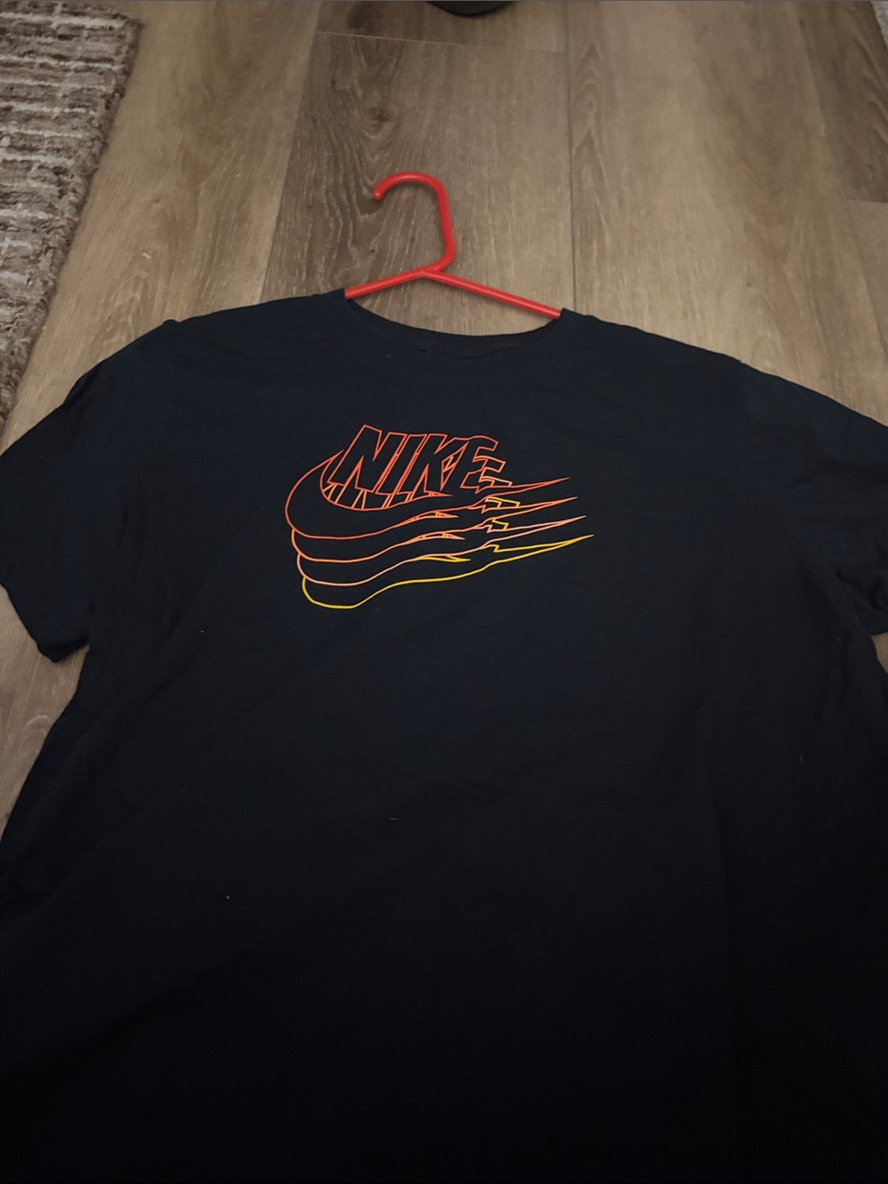 Nike Men’s Black Tee with Red-to-Yellow Gradient Logo